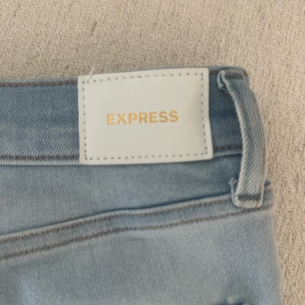Express Blue Jeans with Faded Wash and Visible Stitching